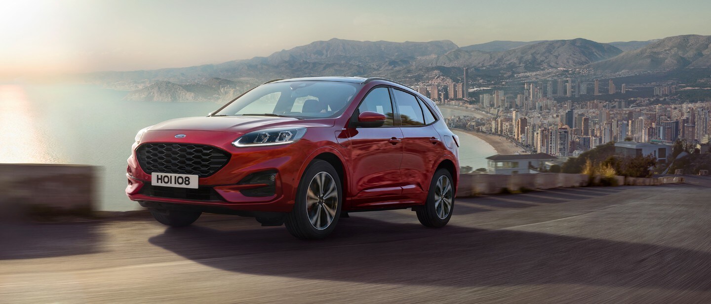 Ford Kuga driving out of a city Ford Kuga driving out of a city