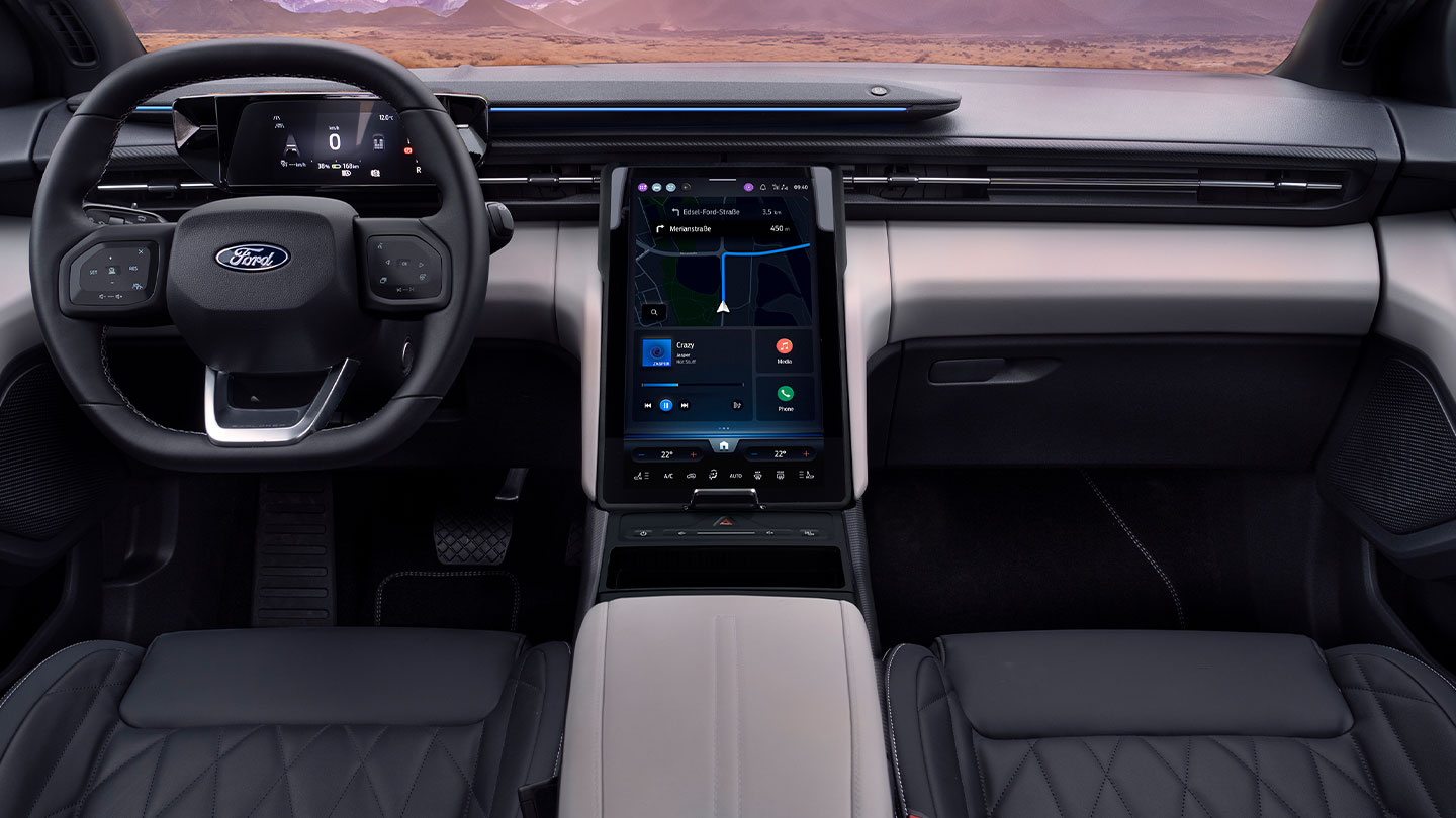 Nahaufnahme des Armaturenbretts des Ford Explorer, die das Lenkrad und den grossen 14,6-Zoll-Touchscreen SYNC Move zeigt.