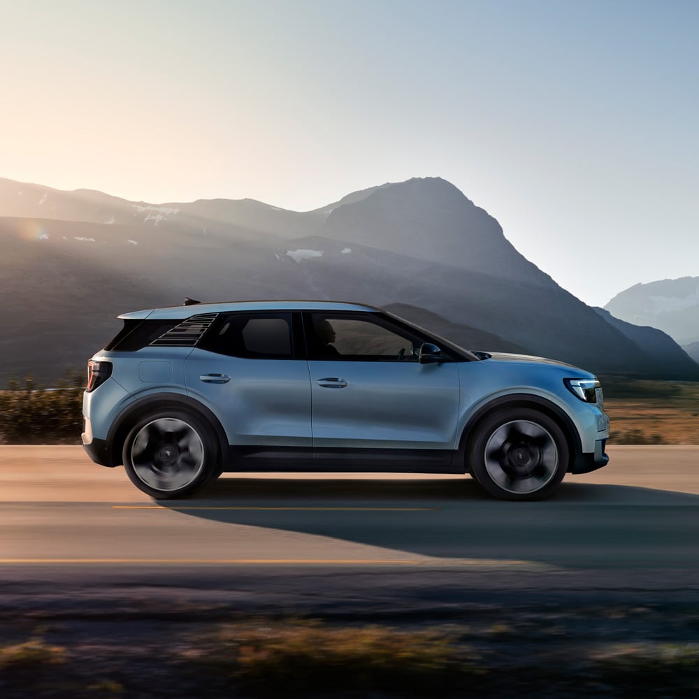 Ford Explorer driving at sunset