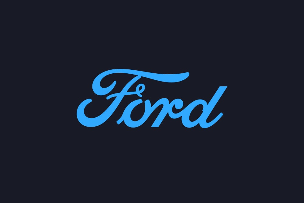 Blaues Ford Schriftzug-Logo auf dunklem Hintergrund.