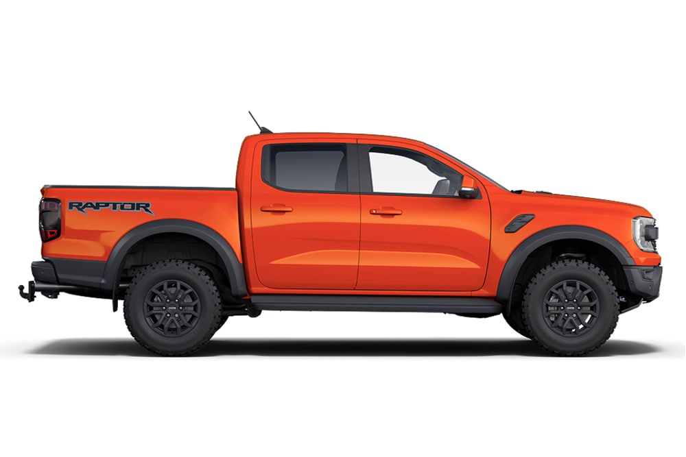 Orangefarbener Ford Ranger Raptor 4x4, ein Modell der Performance-Auto-Reihe von Ford.