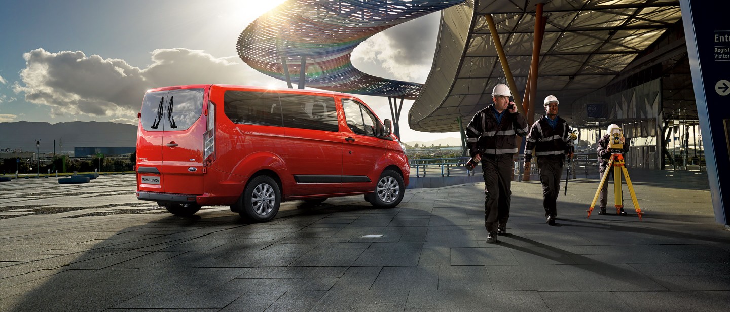New Orange Ford Transit Custom at construction site