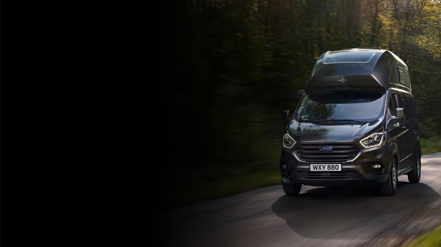 Ford Transit Custom driving on rural road