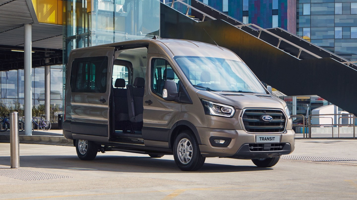 Ford Transit Minibus standing in front of building