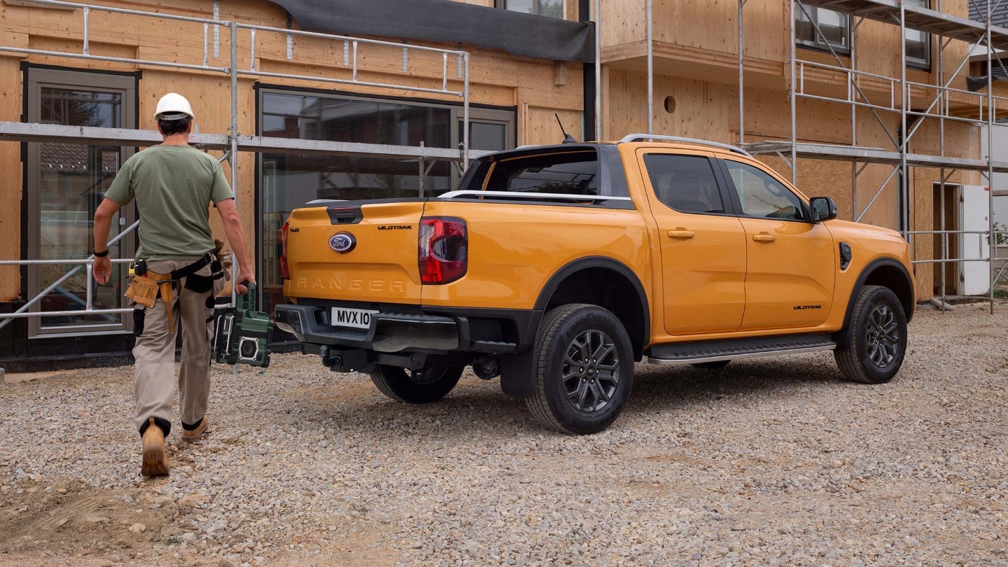 All-New Ford Ranger parked by construction 3/4 rear view