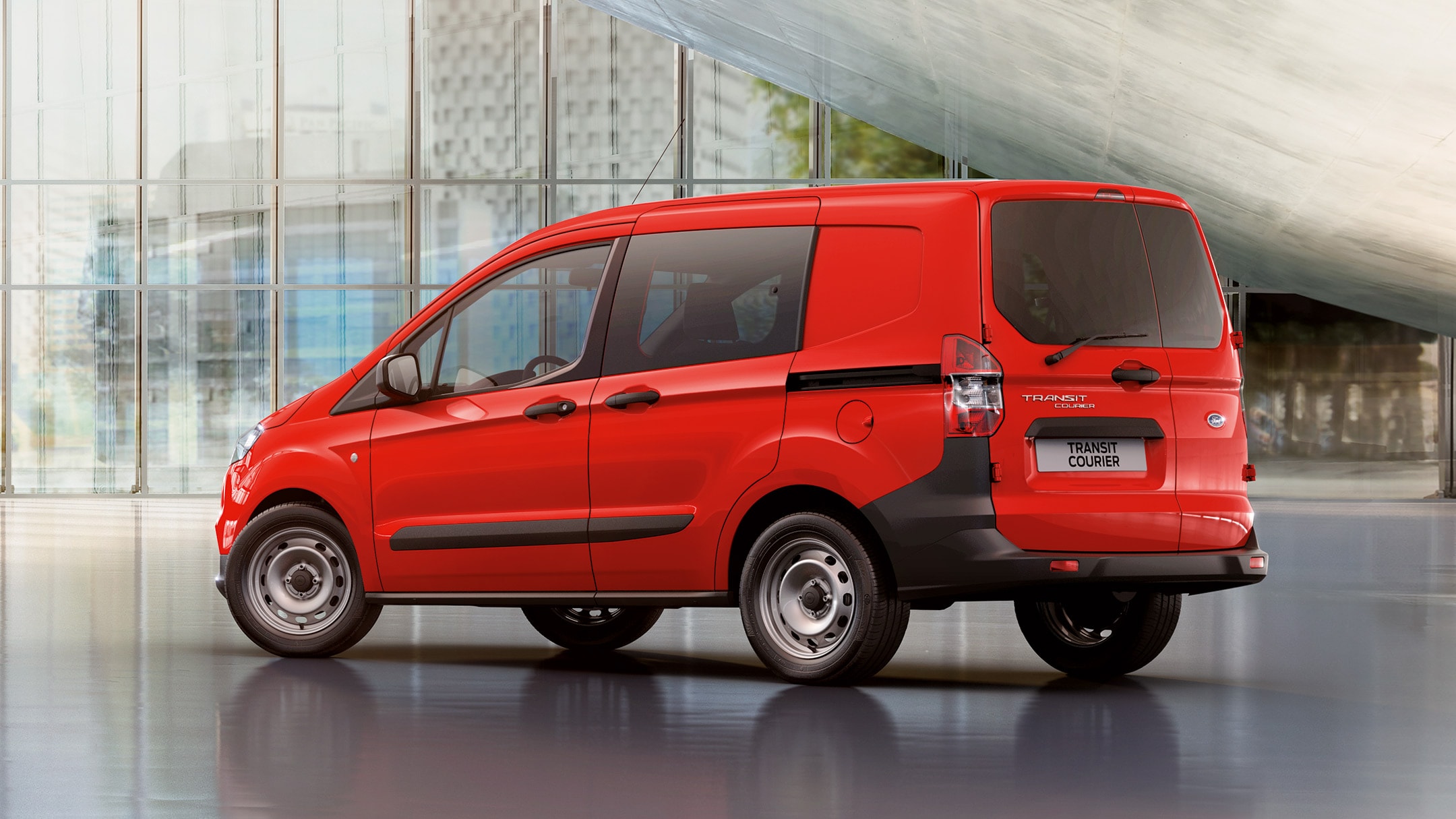 Red Transit Courier Kombi rear view